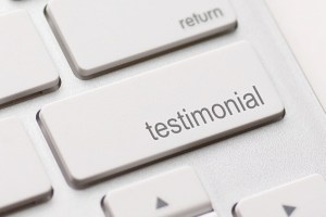 Photo: Keyboard with a Testimonial button